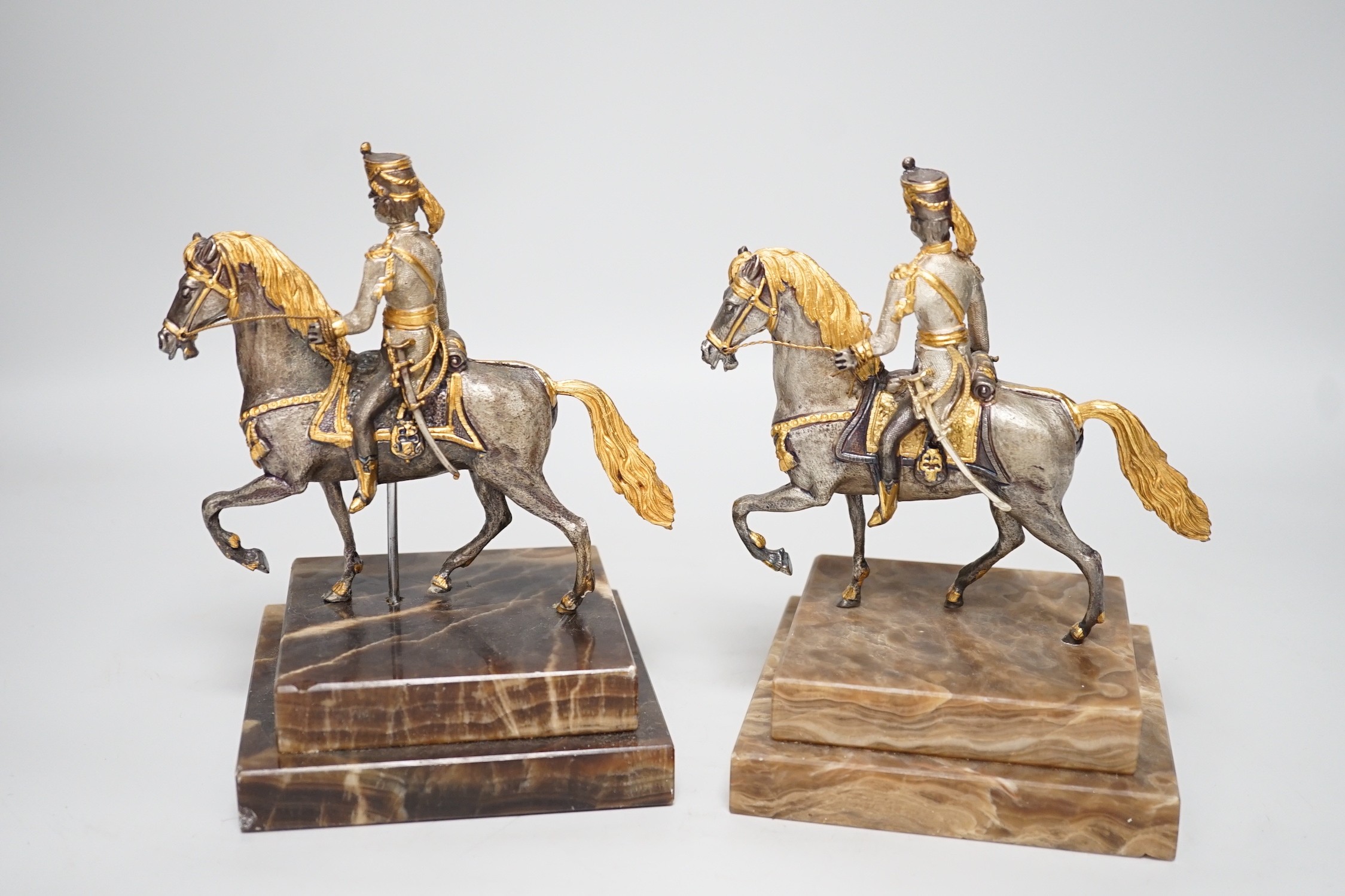 Two limited edition gilt bronze of horseback riders on marble bases, plaques read ‘Cav. AUSTRIACO 1825 1/200’ and ‘26/200’ 17cm